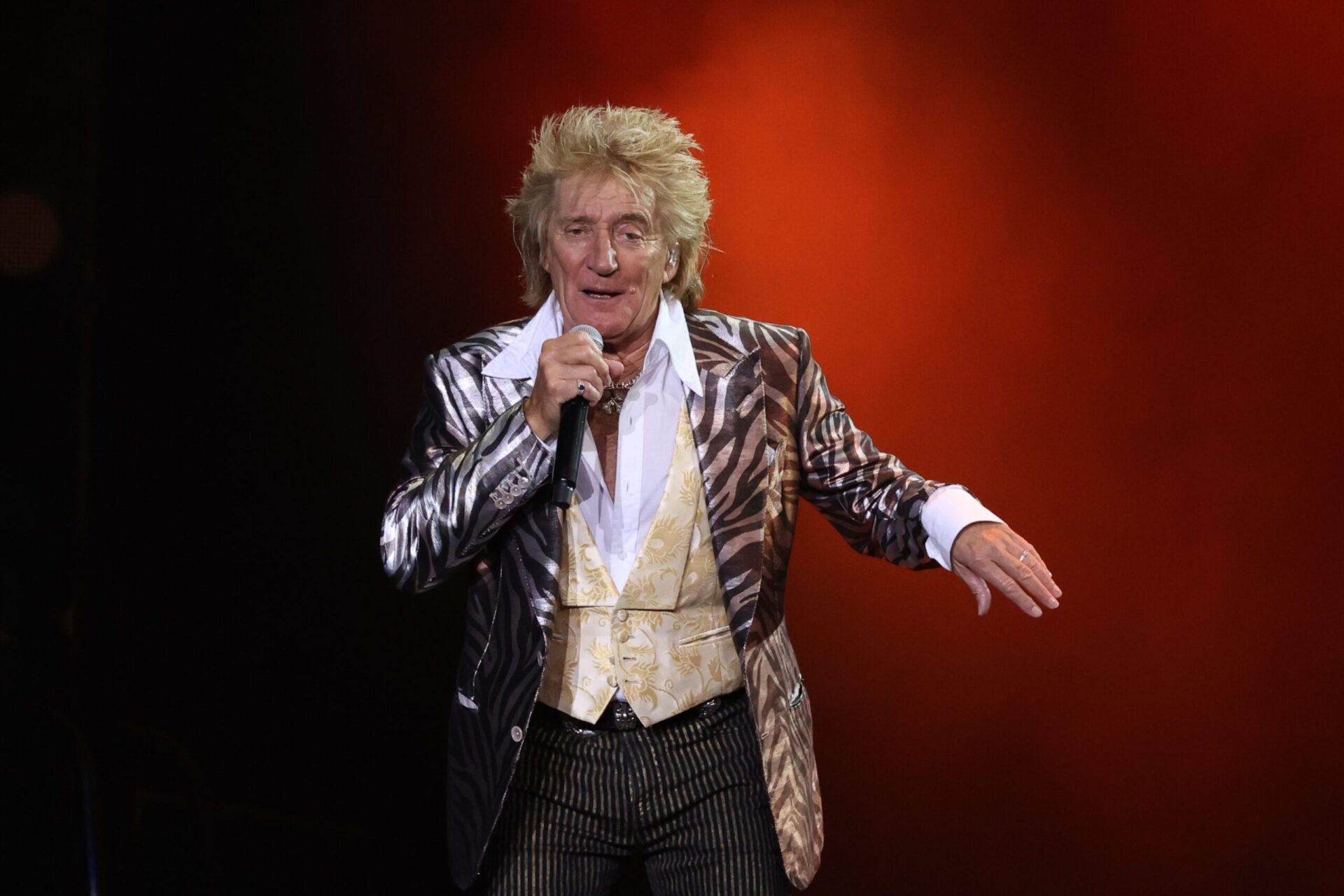 Image of Rod Stewart performing on a set
